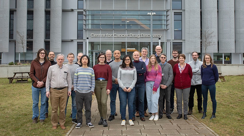 Group shot of the Centre for Protein Degradation team (around 20 people) outside the Centre for Cancer Drug Discovery