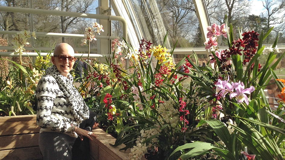 Davina Gardner standing next to flowers