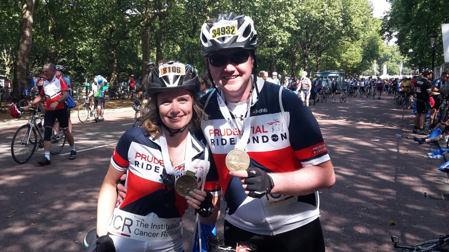 ICR Ride London riders with medals banner