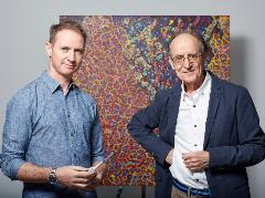 James Cochran and Professor Mel Grieves in front of 'Cell Defence'