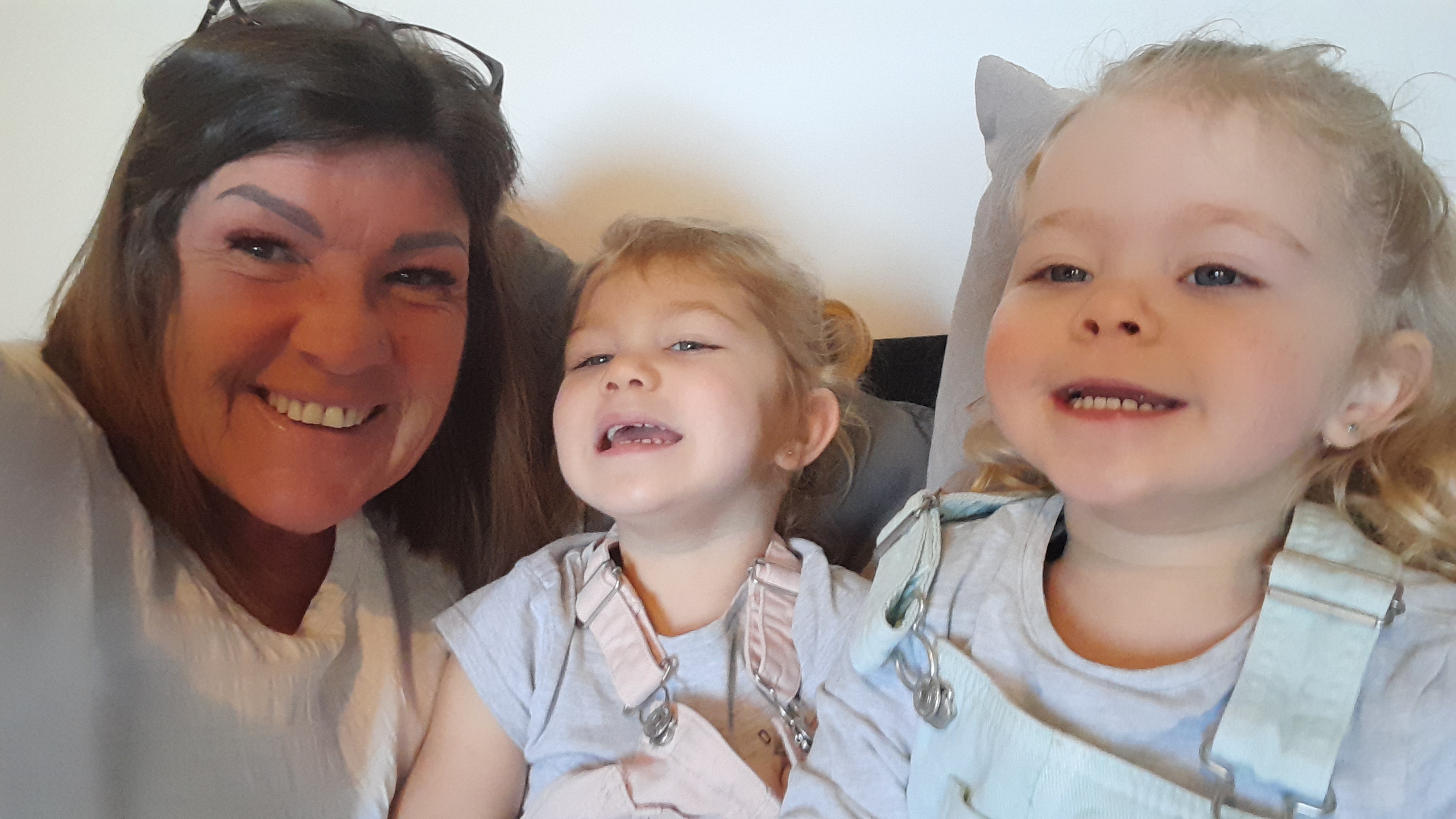 Karen takes a selfie with her two young granddaughters
