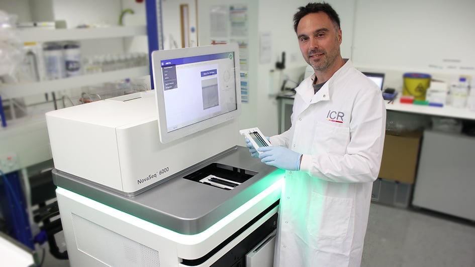 Nik Matthews in a lab with the NovaSeq genome sequencer