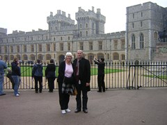Professor Chris Lord and his mum, Janice standing in the foreground in front of a large building
